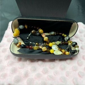 Handcrafted by Evi Vaucher de la Croix..genuine stones hold your glasses